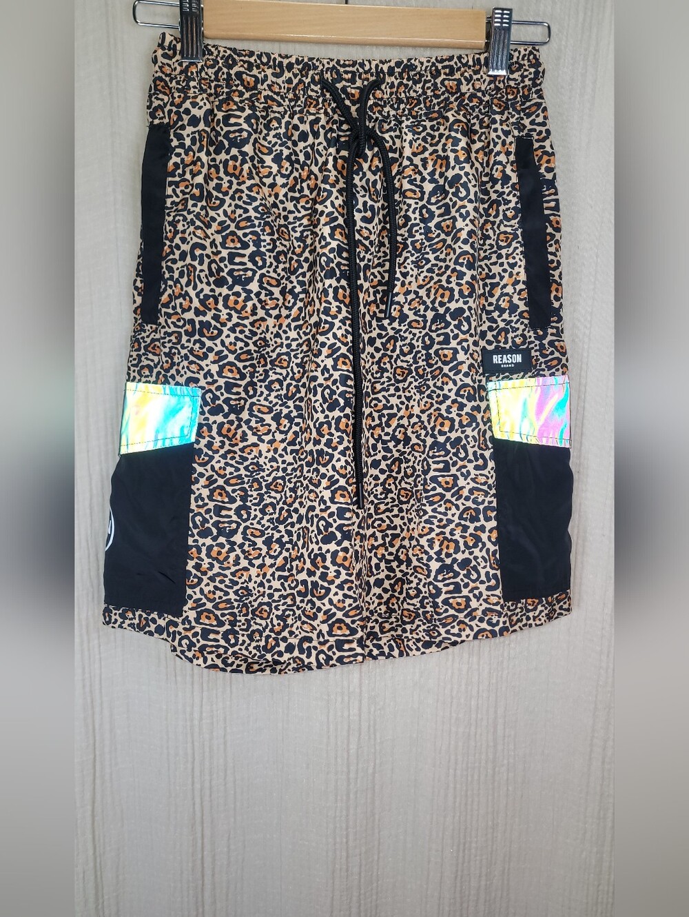 Reason Leopard Print Drawstring Shorts with Black Panels and Iridescent Accent